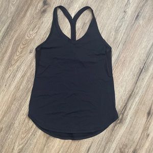 Lululemon black tank top with mesh under arm in size 4